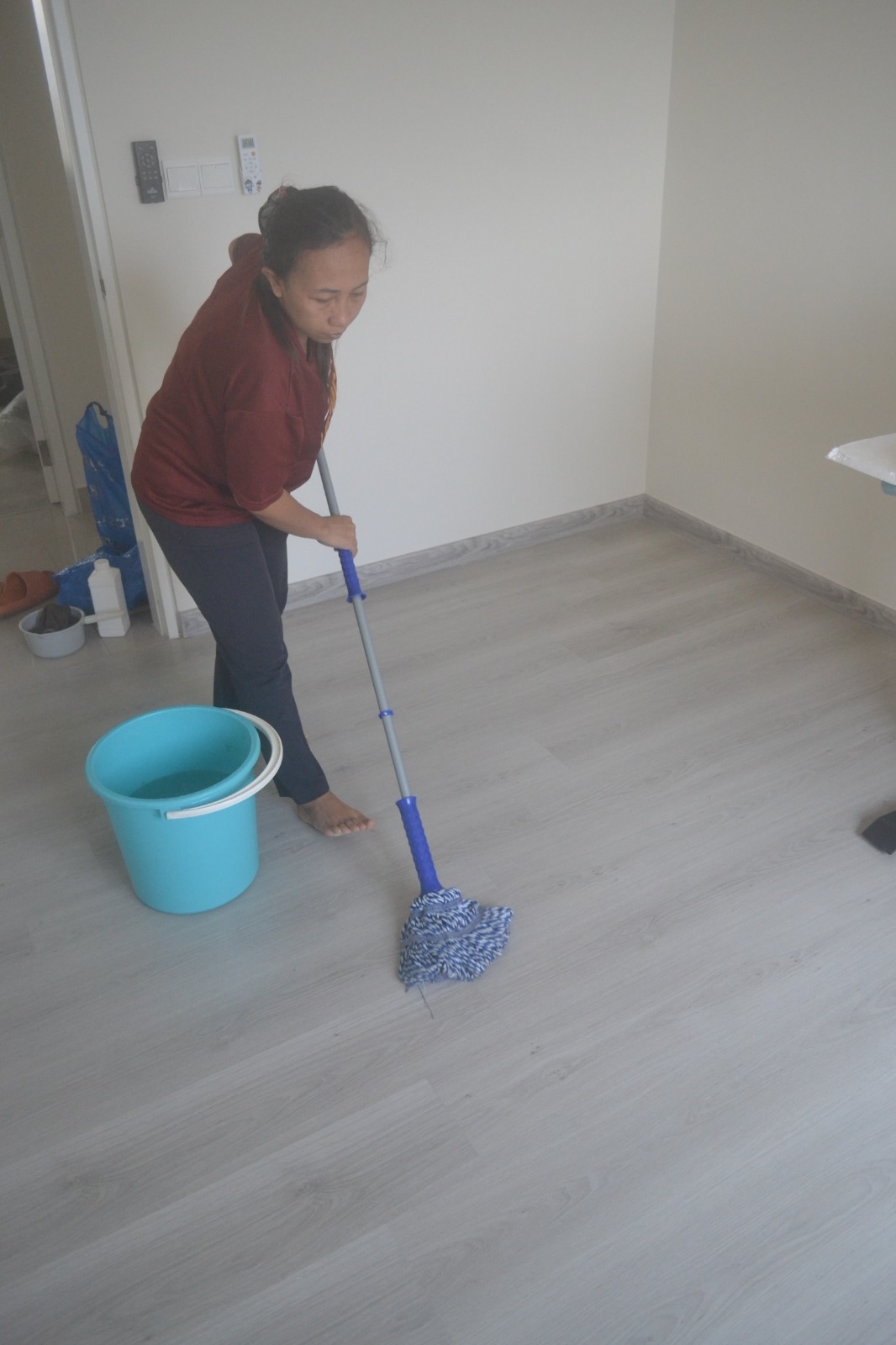 ServiceKru crew mopping an empty room floor